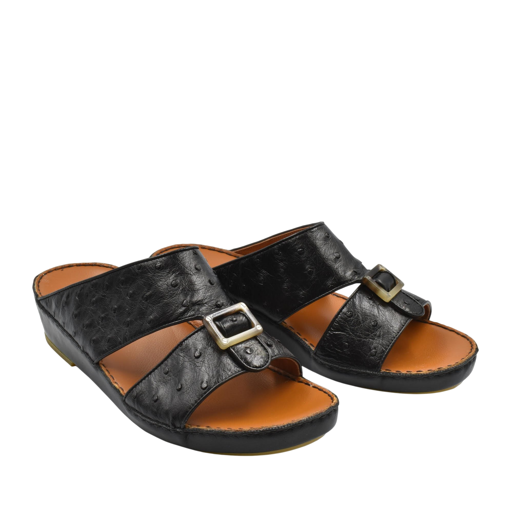 Black ostrich leather sandals with buckle detail and cushioned tan footbed