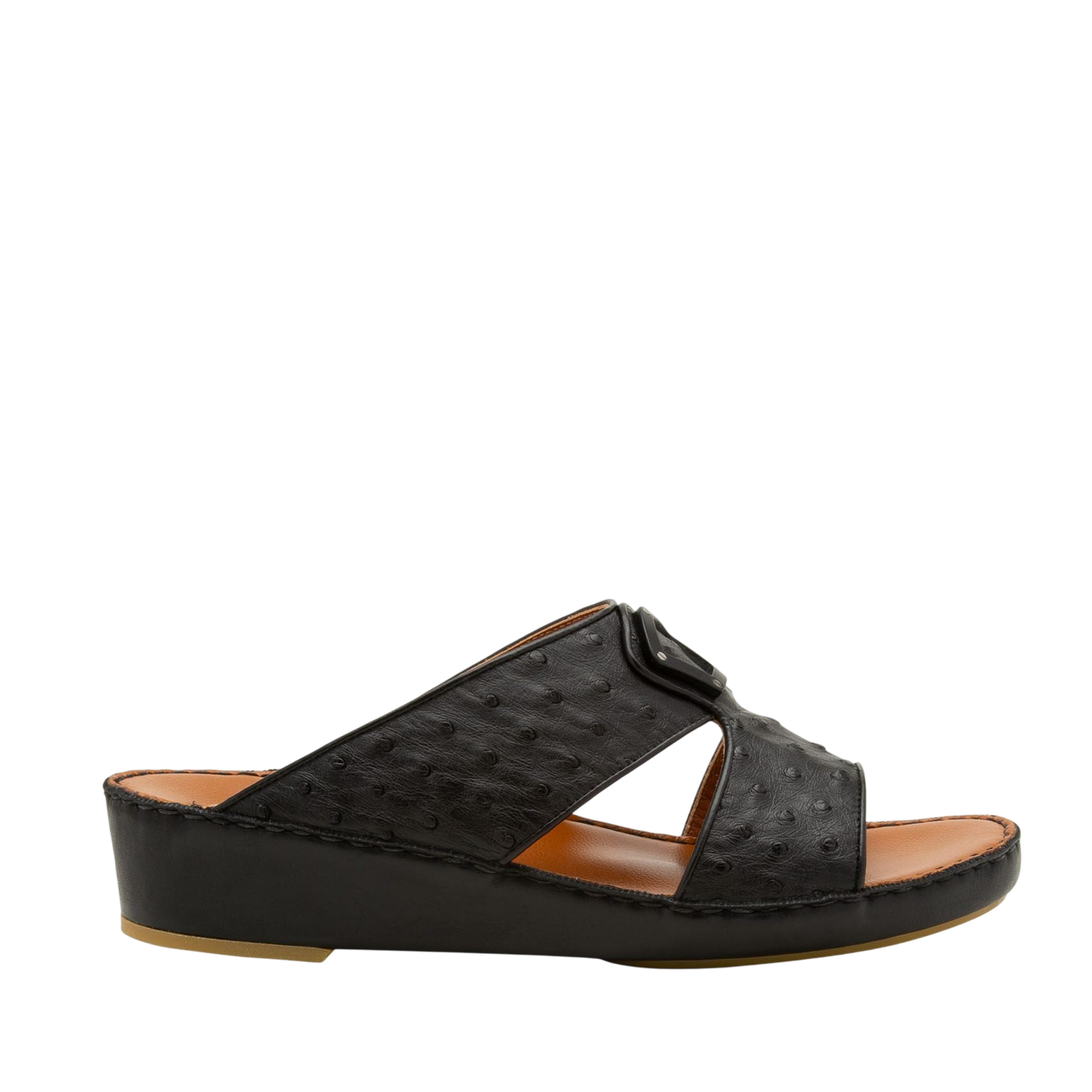 Black ostrich leather sandals with cushioned tan footbed and low wedge heel side view