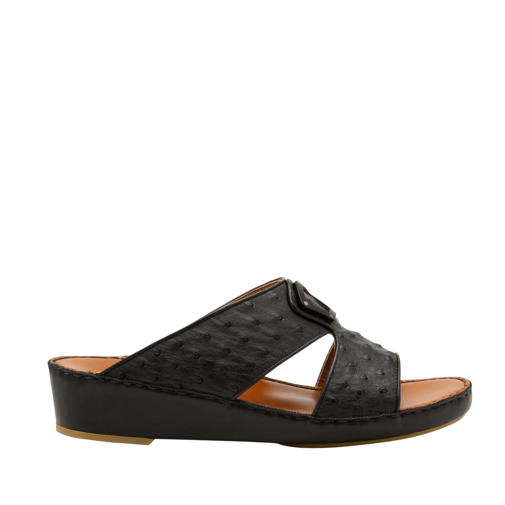 Black ostrich leather sandals with cushioned tan footbed and low wedge heel side view