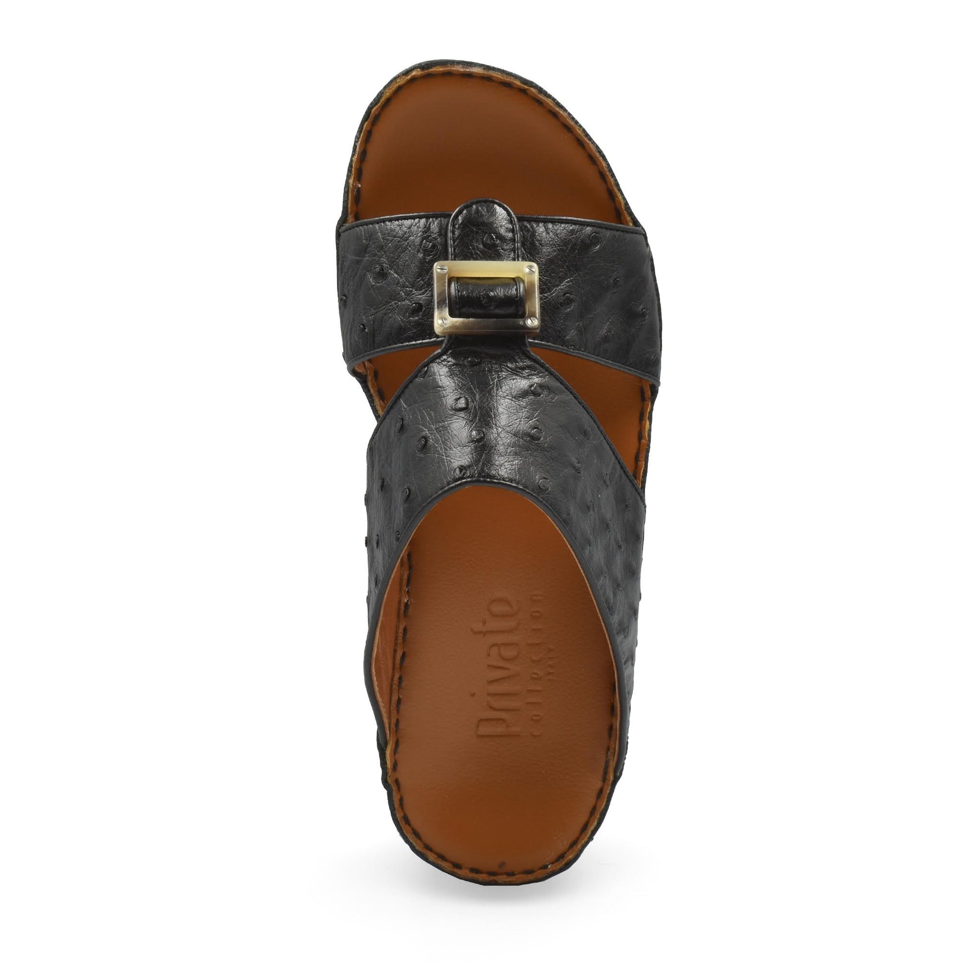 Black ostrich leather sandals with buckle detail and brown footbed from Private collection