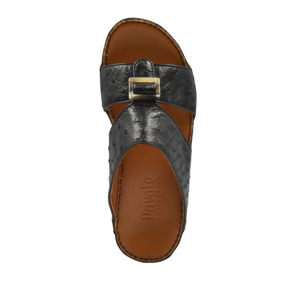Black ostrich leather sandals with buckle detail and brown footbed from Private collection