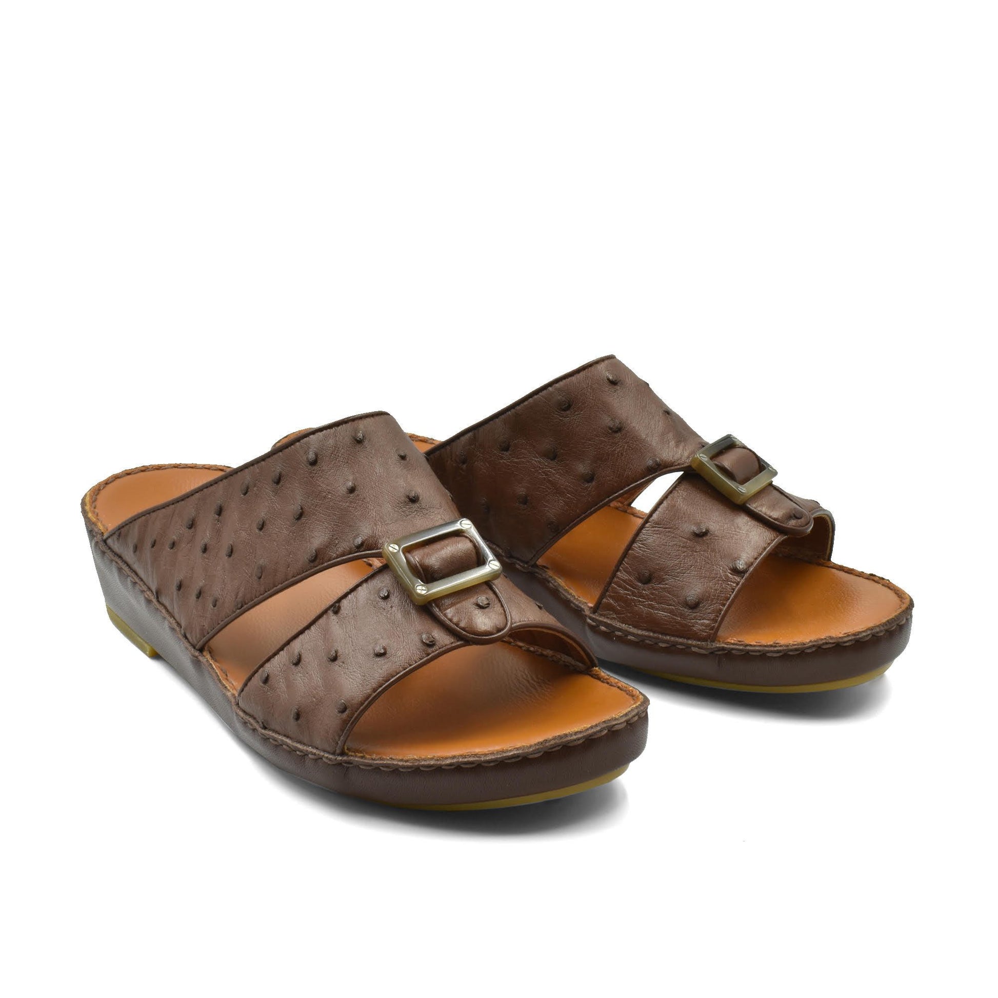 Brown ostrich leather sandals with buckle strap and cushioned sole for comfortable wear
