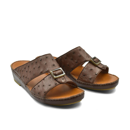 Brown ostrich leather sandals with buckle strap and cushioned sole for comfortable wear