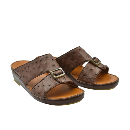 Brown ostrich leather sandals with buckle strap and cushioned sole for comfortable wear