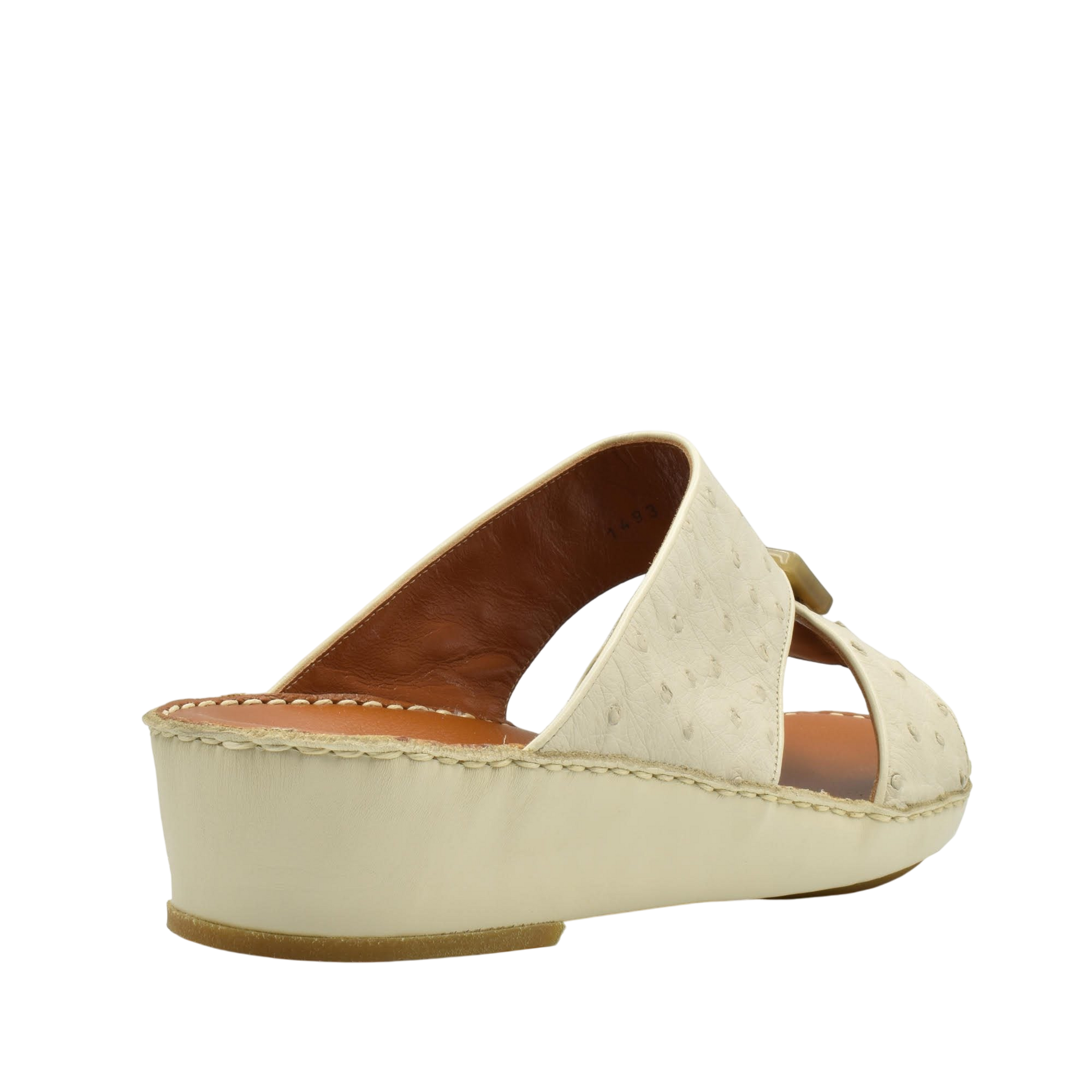 Cream-colored ostrich leather sandals with wedge heel and open toe design from Private Collection