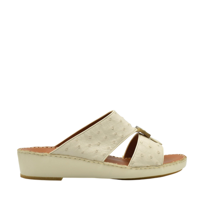 Cream-colored ostrich leather sandals with wedge heel and open toe design