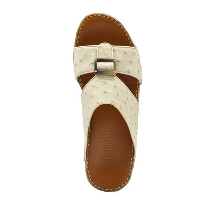 Cream ostrich leather sandals with buckle strap and brown leather footbed from Private collection