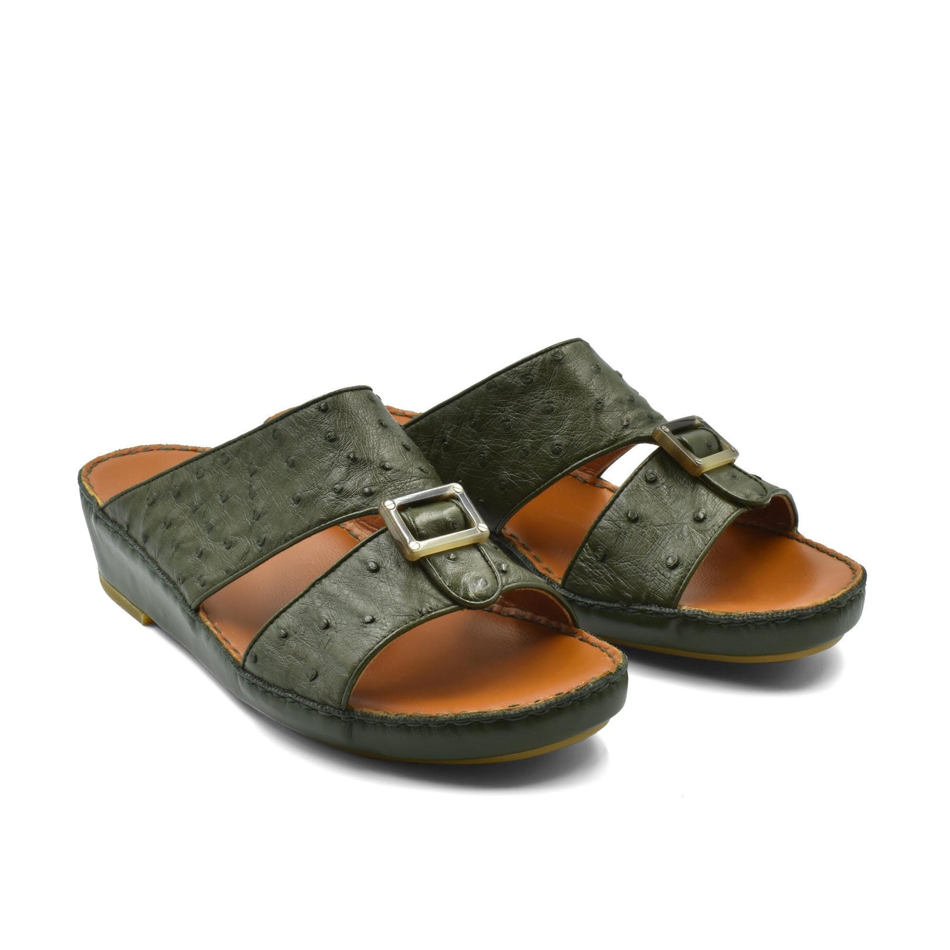 Green ostrich leather sandals with buckle straps and cushioned brown footbed for comfortable wear