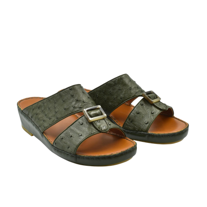 Green ostrich leather sandals with buckle straps and cushioned brown footbed for comfortable wear