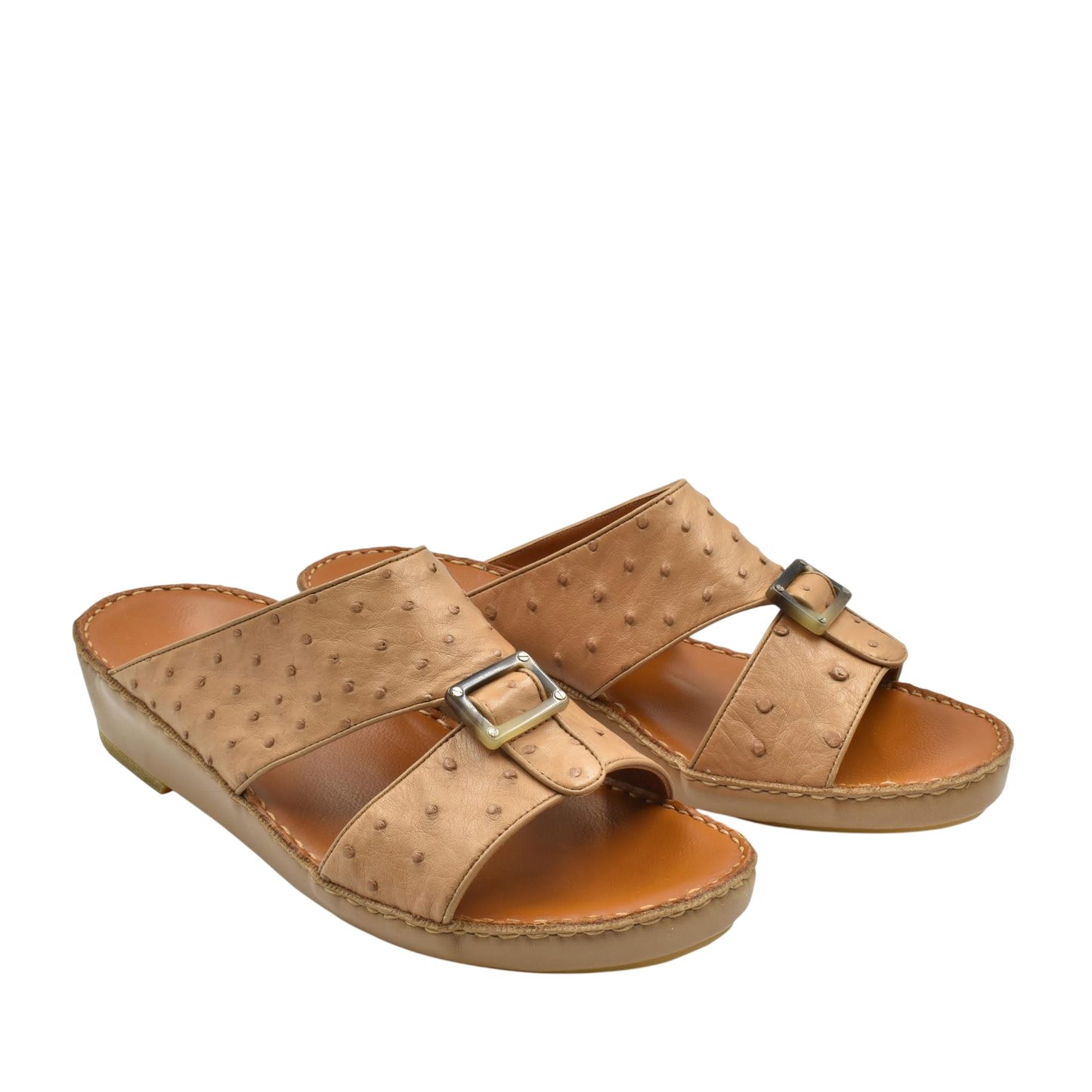 Tan ostrich leather sandals with buckle straps and cushioned soles for comfortable wear