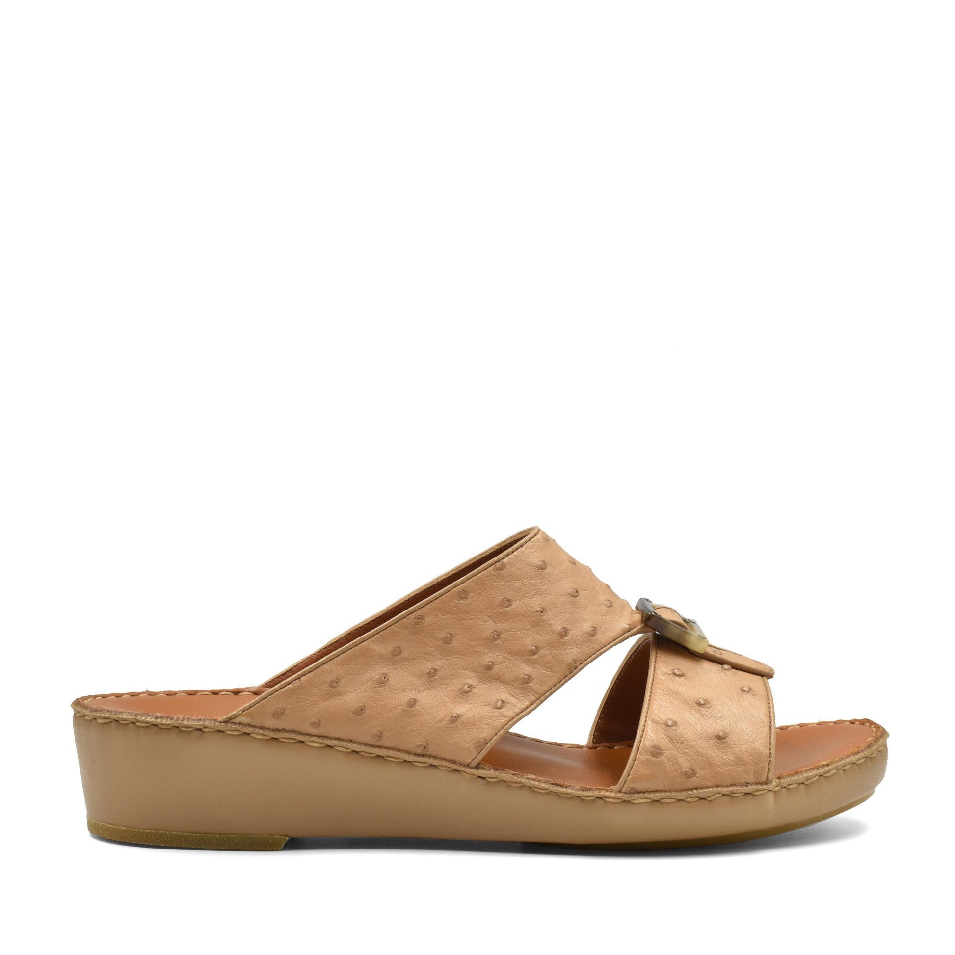 Beige ostrich leather sandals with a low wedge heel and open toe design