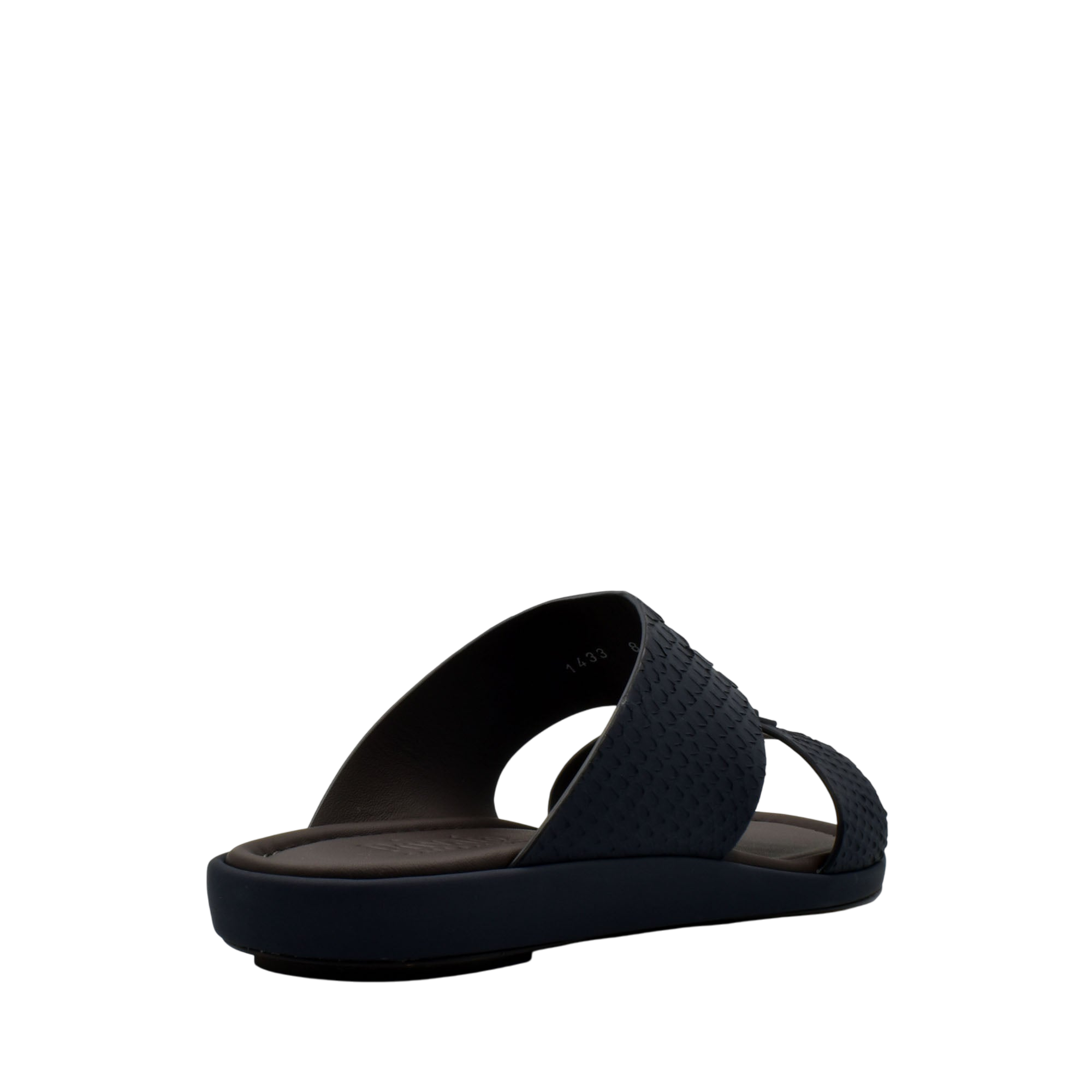 Black slip-on sandals featuring textured python skin footwear design with cushioned sole