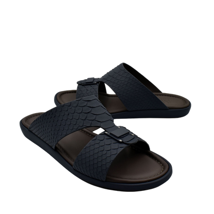 Black python skin footwear slides with textured straps and adjustable buckles for comfortable wear