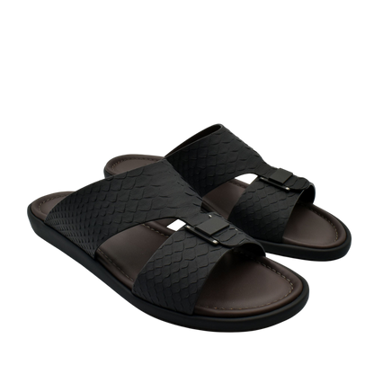 Black open-toe slides with textured python skin footwear straps and cushioned brown footbed