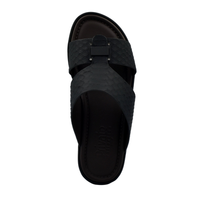 Black slip-on sandal featuring python skin footwear design with textured straps and open toe