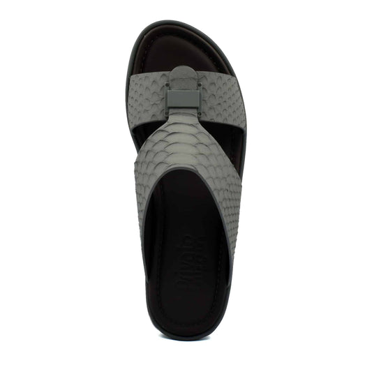 Top view of gray python skin footwear sandal with textured strap and cushioned sole