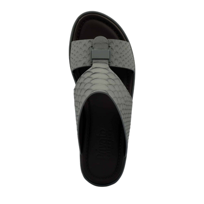 Top view of gray python skin footwear sandal with textured strap and cushioned sole