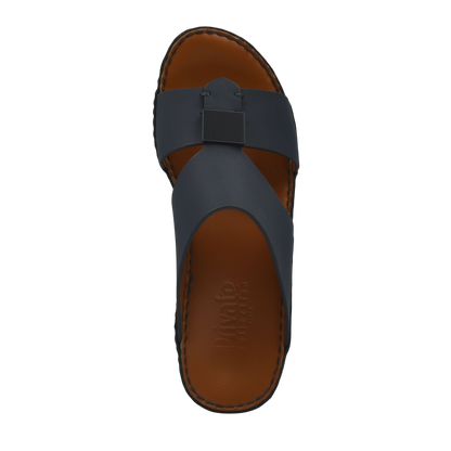 Top view of black Quadratura Gomato sandals with brown footbed and stitched edges from Private Collection