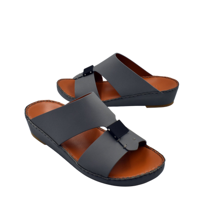 Black and brown Quadratura Gomato slides with wide straps and cushioned sole for comfortable wear
