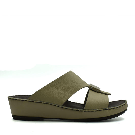 Side view of olive green Quadratura Isola Lustre sandals with a wedge sole and buckle detail