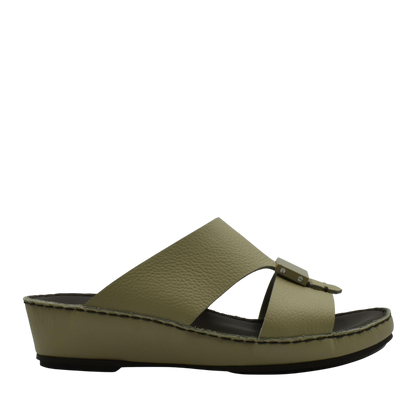 Side view of olive green Quadratura Isola Lustre sandals with a wedge sole and buckle detail