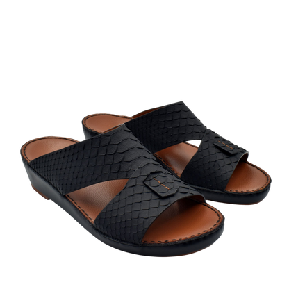 Black open-toe slip-on rubber python shoes with textured design and brown cushioned footbed