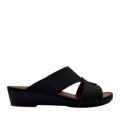 Black slip-on rubber python shoes with low wedge heel and textured upper design