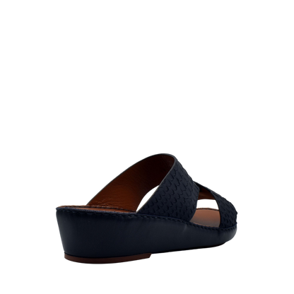 Black wedge slip-on rubber python shoes with textured upper and comfortable sole
