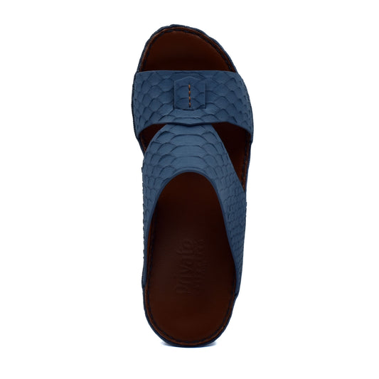 Blue slip-on rubber python shoes with textured scale pattern and open-toe design
