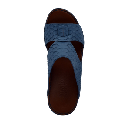 Blue slip-on rubber python shoes with textured scale pattern and open-toe design