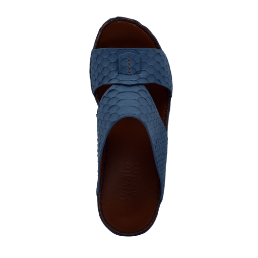 Blue slip-on rubber python shoes with textured scale pattern and open-toe design