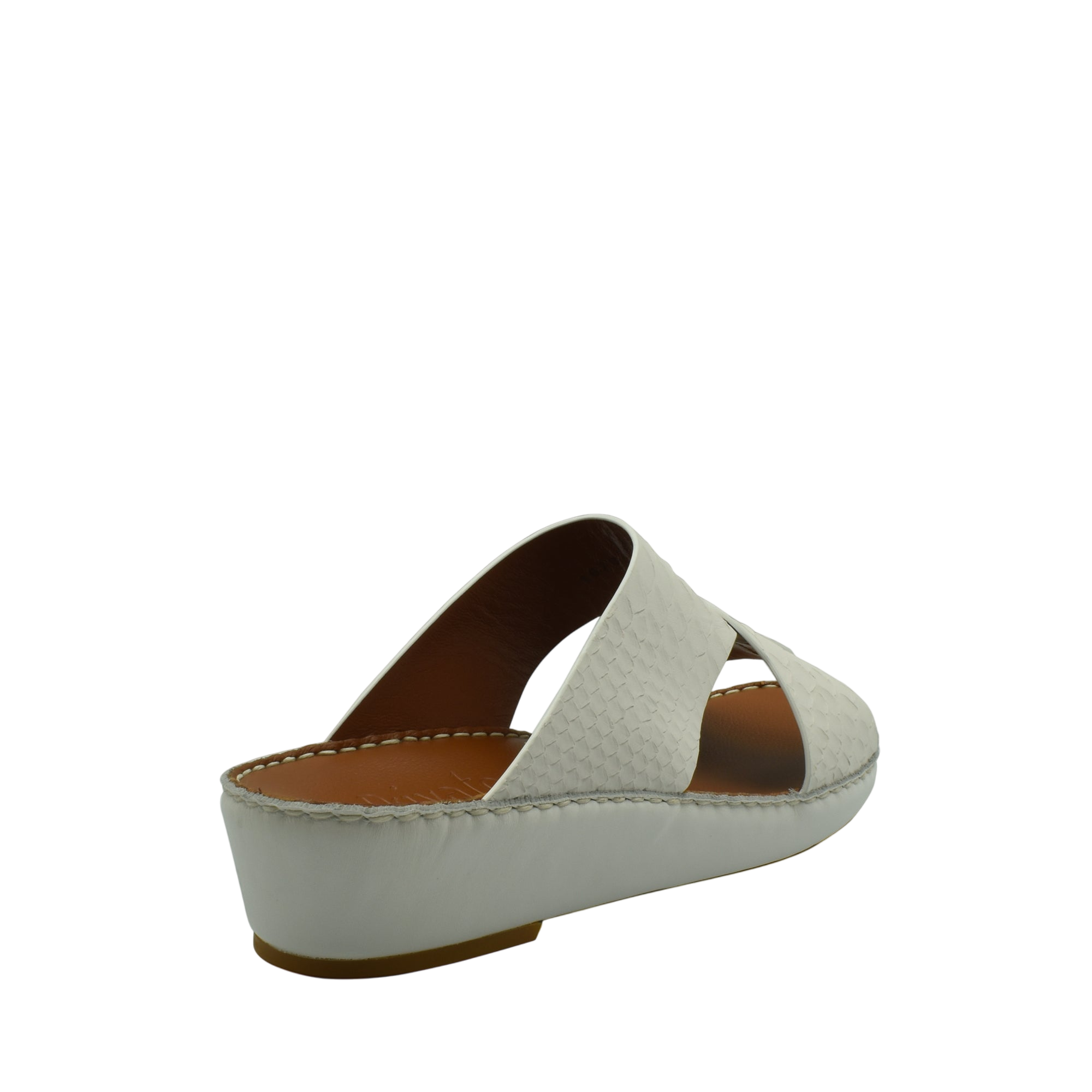 White slip-on rubber python shoes with a low wedge heel and textured upper from Private Collection