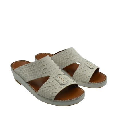 Light gray rubber python shoes with open toe and textured scale pattern in slide sandal style