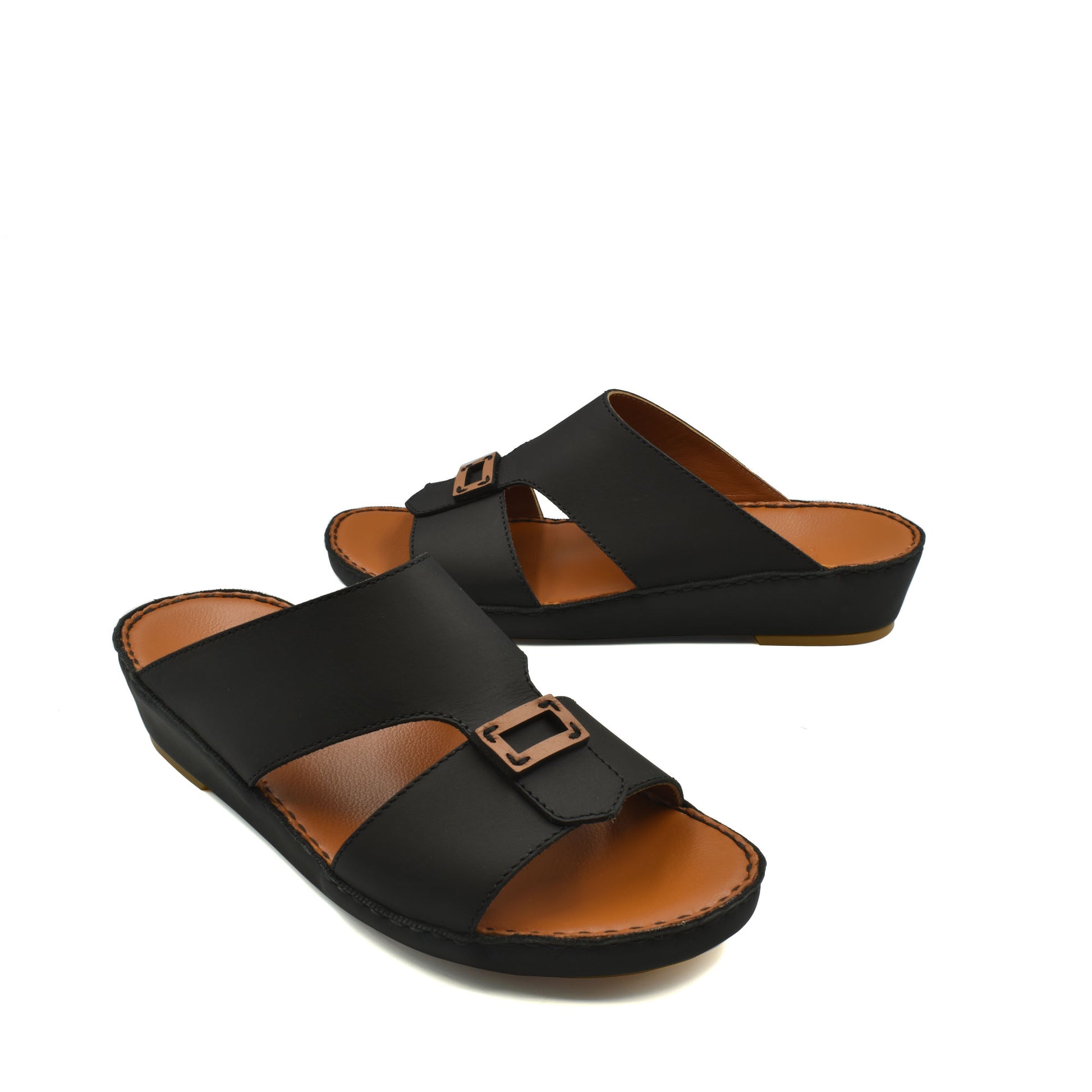 Black leather rubbercalf contrast sandals with adjustable buckles and cushioned brown footbed
