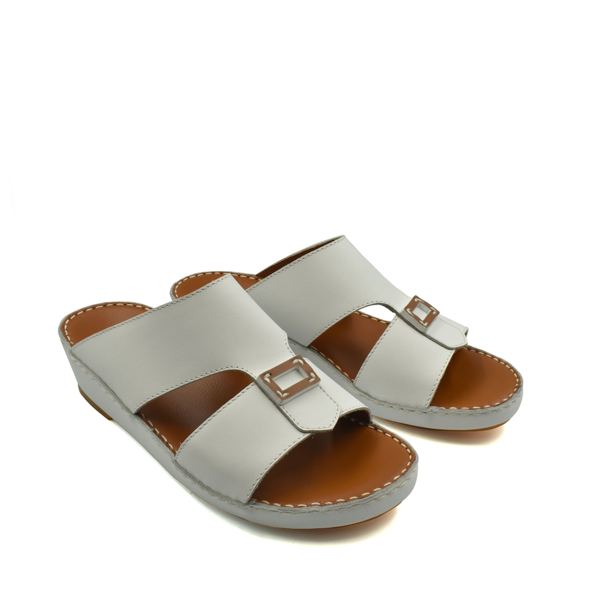 White rubbercalf contrast sandals with open toe and buckle detail on brown sole