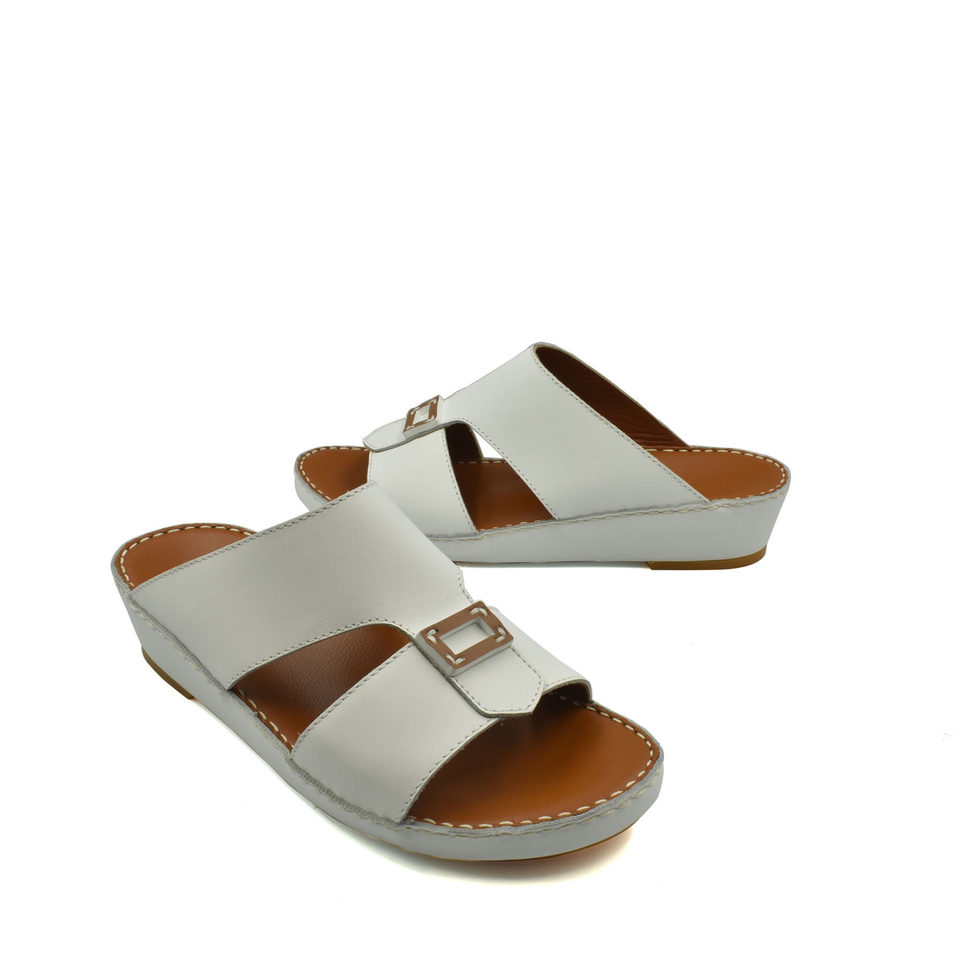 White rubbercalf contrast sandals with buckle detail and cushioned sole for comfortable wear