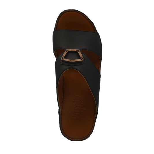 Top view of Rubbercalf contrast shoes in black with brown sole and decorative buckle detail