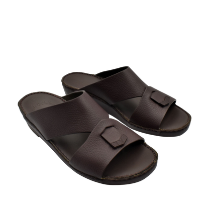Trendy leather slide sandals in dark brown with a wide strap and decorative buckle detail