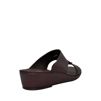 Brown trendy leather slide sandals with cushioned sole from Private collection