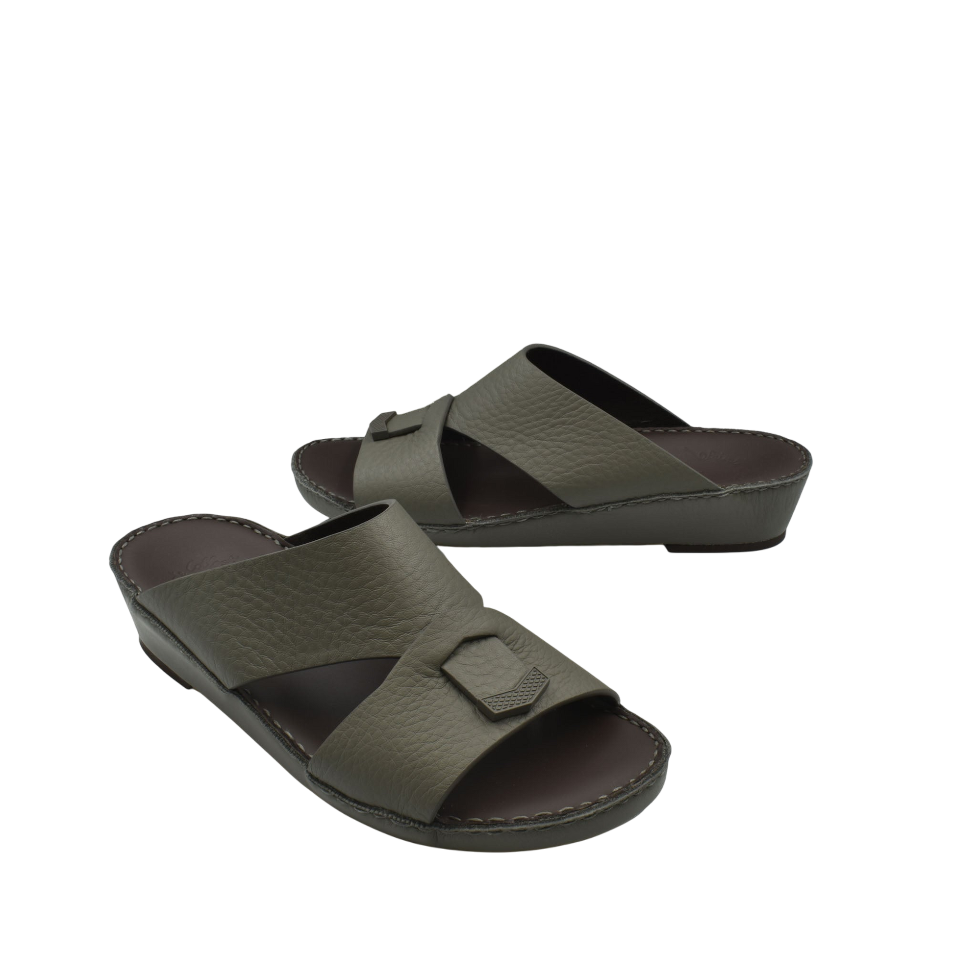 Trendy leather slide sandals in dark olive with a wide strap and decorative buckle detail