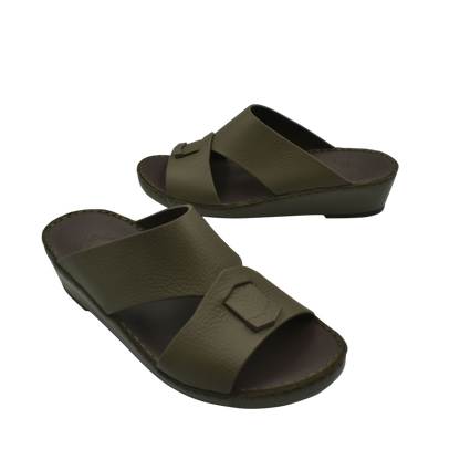 Trendy leather slide sandals in olive green with cushioned sole and cross-strap design