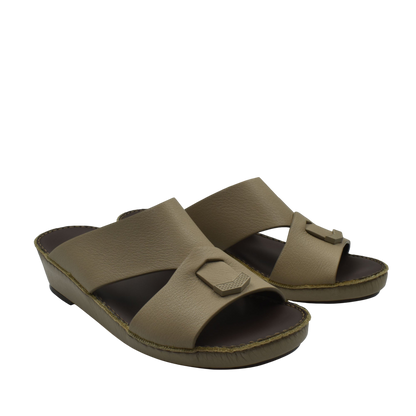 Trendy leather slide sandals in tan with wide straps and cushioned footbed for comfortable wear