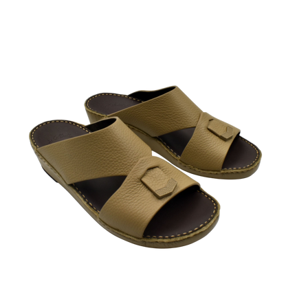 Trendy leather slide sandals in tan with wide straps and cushioned sole for comfortable wear