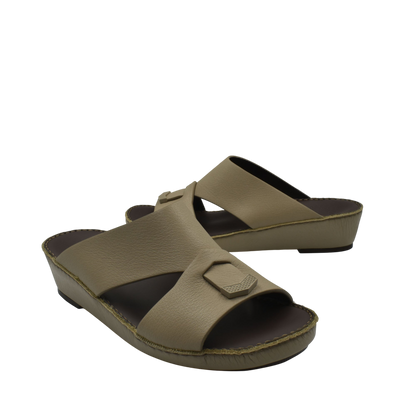 Trendy leather slide sandals in tan with wide cross straps and low wedge sole from Private Collection