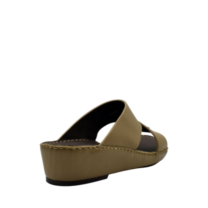 Beige trendy leather slide sandals with a slight wedge heel and open toe design