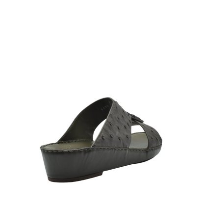 Black ostrich leather sandals with wedge heel and open toe design from Private Collection