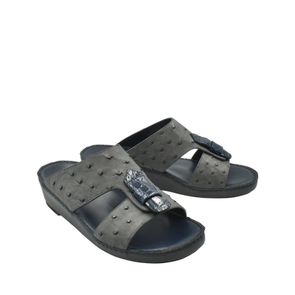 Black ostrich leather sandals with textured pattern and buckle detail from private collection