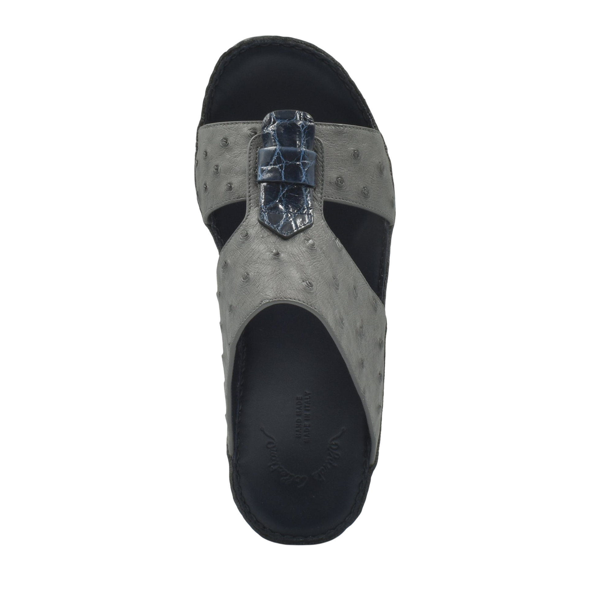 Top view of gray ostrich leather sandals with black sole and detailed strap design
