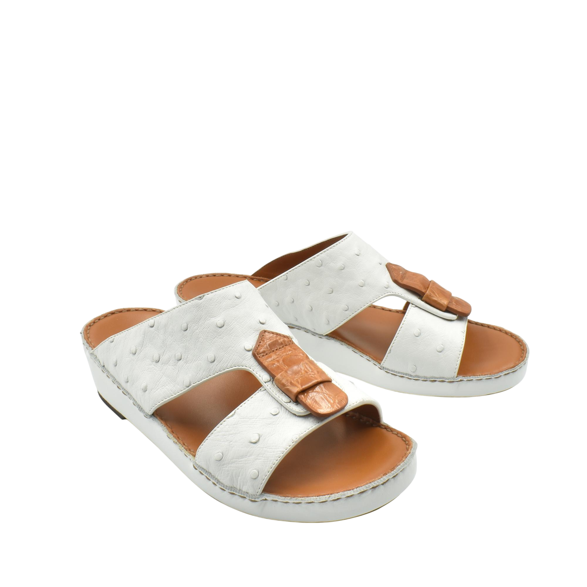 White and brown ostrich leather sandals with adjustable straps and cushioned soles
