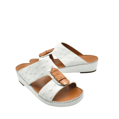 White ostrich leather sandals with tan leather details and comfortable cushioned sole